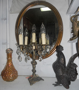 Carnival glass decanter, crystal chandelier and iron rooster